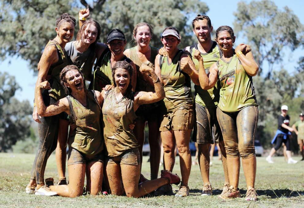 Chloe Moses, Molly Daly and their teammates didn’t mind getting a little muddy during the challenge.