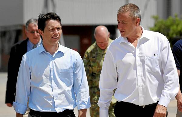 Jason Clare and Alan Williamson during a visit to Bruck earlier this year. Mr Williamson wants an answer from the government on the decision to pay a US company to design a new camouflage pattern for the defence force.