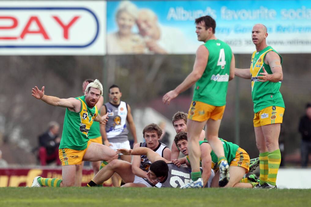 North Albury coach Jason Akermanis appeals for holding the ball at Bunton Park on Saturday.