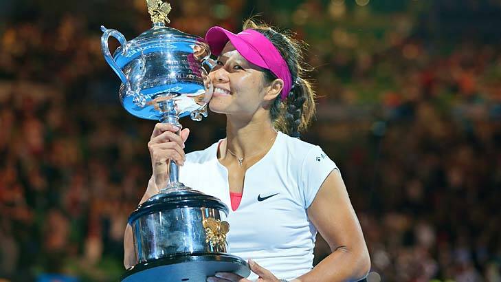 Li Na kisses her trophy after defeating Dominika Cibulkova in straight sets in the final. Photo: Wayne Taylor