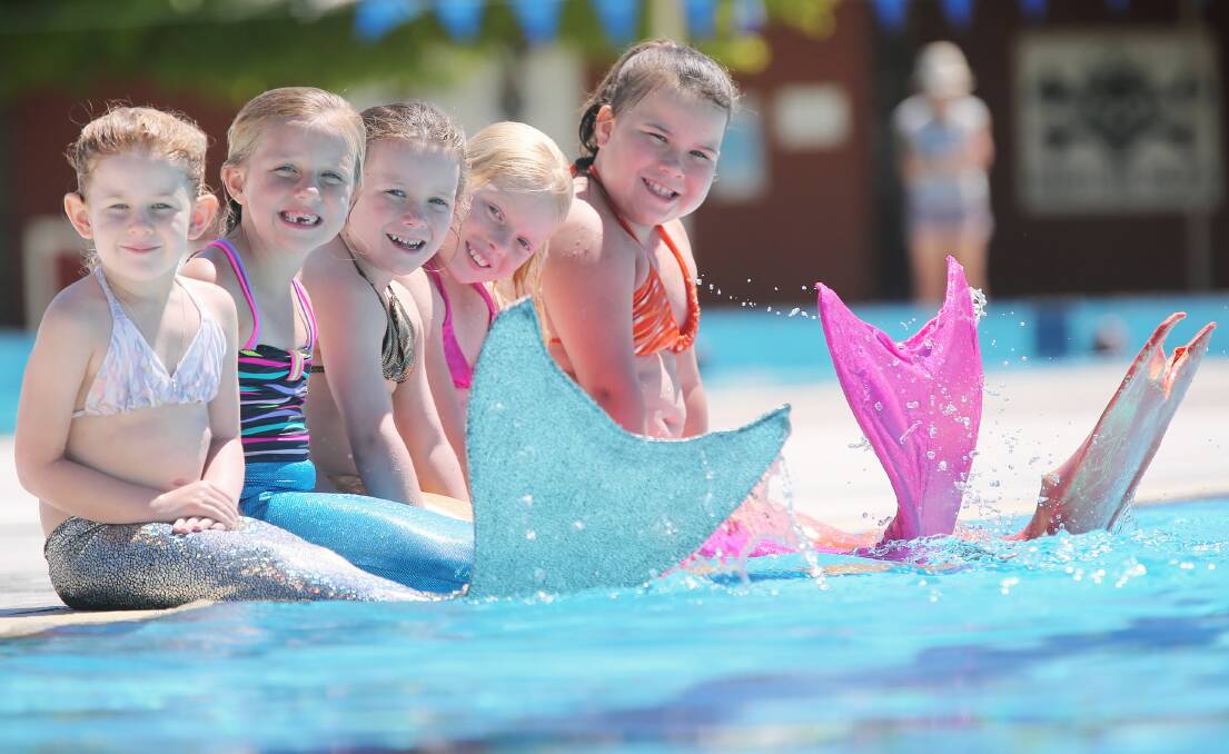 Sienna Capper, 5, Lilly McAuliffe, 6, Mackenzie Rayner, 7, Angel Hawkins, 9 and Piper Yarner, 8, had no problem finding their sea legs in the mermaid tails they wore to celebrate Mackenzie’s seventh birthday yesterday. Picture: JOHN RUSSELL
