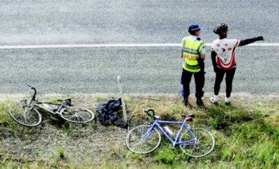 The black and yellow bicycle, left, ridden by the hit cyclist remained on the side of the road as police interviewed witnesses. Pictures: JOHN RUSSELL