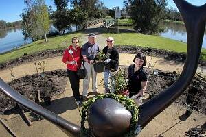 Cr Anna Speedie yesterday joined Ian Harrison, Jude Campbell, Jenny Black and other Brave Hearts volunteers to replant roses vandals destroyed at the Celebrations Rose Garden. Picture: TARA ASHWORTH