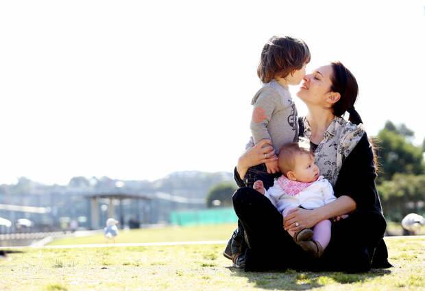 Favours a firm voice: Yvette Andronicus with son Charlie, 2, and daughter, Gia, seven months. Photo: Brianne Makin