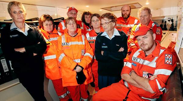 Jean Blackwell and Elsie Hamlin, in the blue uniforms, inside the caravan with other members of Tallangatta SES unit. The caravan is standing in as the unit headquarters and communications room of the unit after their dilapidated council building was declared unsafe. Picture: JOHN RUSSELL