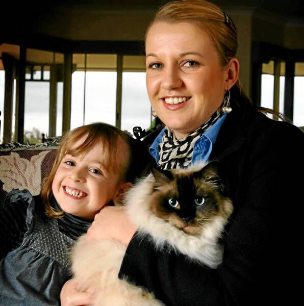 Lily Jones, 5, and her mother Angie with their cat, Buddy. Picture: DAVID THORPE