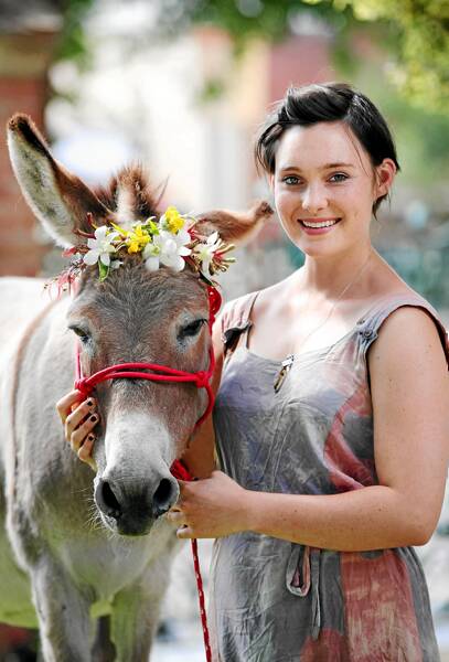 Lisa Mitchell with her family’s donkey, Trixie, outside St Matthew’s. Picture: JOHN RUSSELL