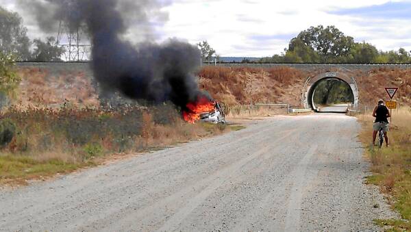 A Wodonga woman was charged with arson following a car fire at Gateway Island on Sunday.