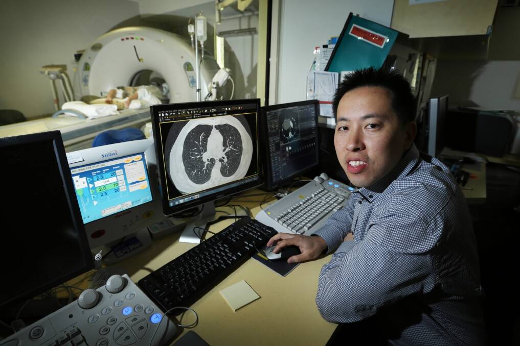 Radiologist Andrew Kong views a CT scan as a patient undergoes a test. Picture: MATTHEW SMITHWICK