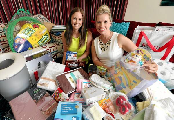 Workmates Kelly Ragen and Amanda Kotzur with goods they’ve collected for former homeless couple “Paul and Jane”. Both were touched by the story in last week’s Border Mail. Picture: KYLIE ESLER