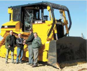 Ron Patterson, of the DSE, Darren Hodge from William Adams Pty Ltd, Rob Kohne and John Lloyd with the new dozer.
