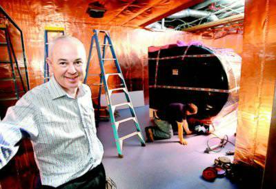 Dr James Mullins inside the copper-lined room housing the machine. Pictures: PETER MERKESTEYN