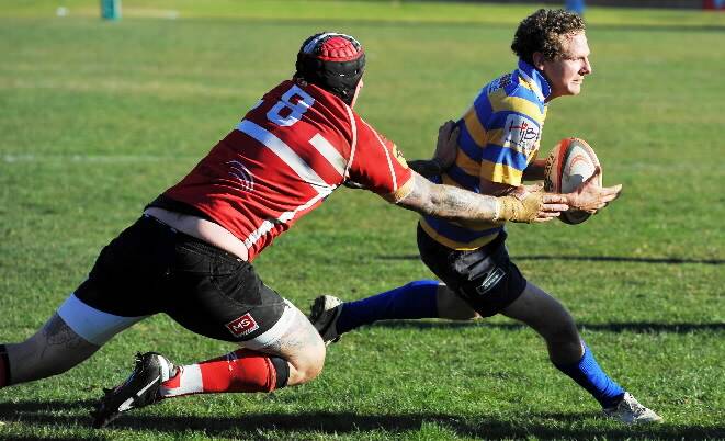 Two-try hero and halfback Sandy Middleton skips around CSU’s Sterling Ross at Wagga on Saturday. Picture:  DAILY ADVERTISER
