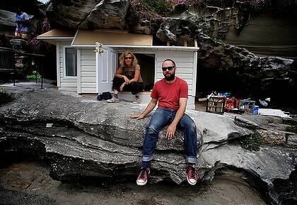 Seaside mansion ... Anne Zahalka and Aaron Sampson with their house sculpture.
