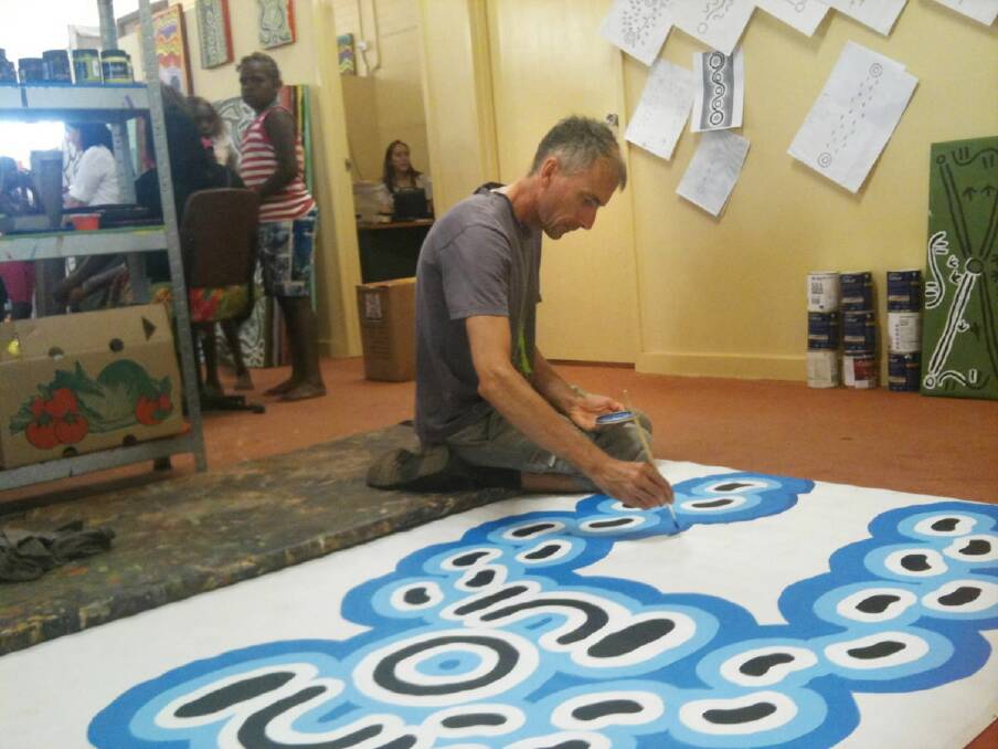 Former Wangaratta man Tim Newth works on an art project in Darwin, where he is now based.