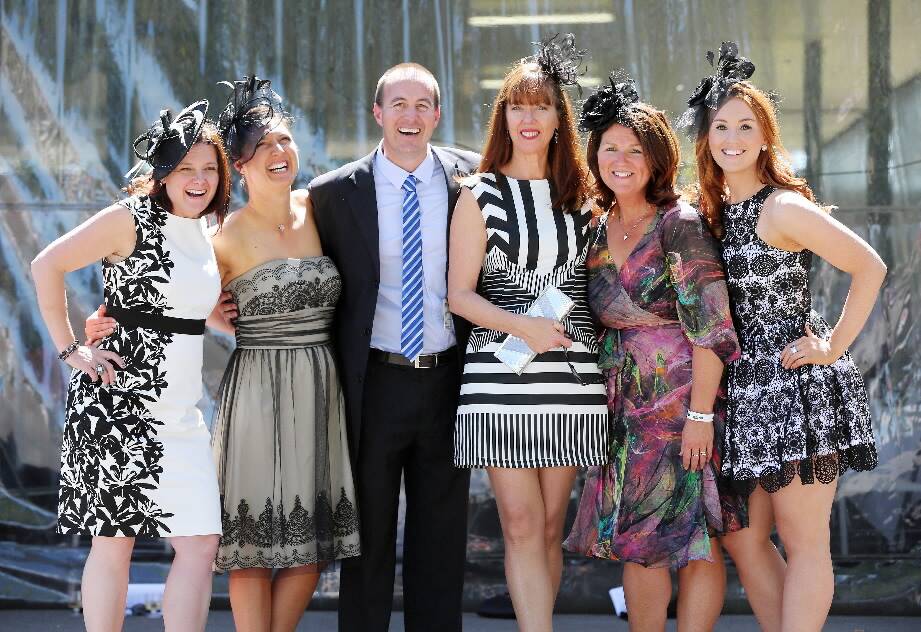 At Albury racecourse yesterday were Wendy Brown, Natasha Callewaert, Ben White, Trish Austin-Hore, Madeline Wood, and Amy van de Ven, who wore more subtle colours. Pictures: JOHN RUSSELL