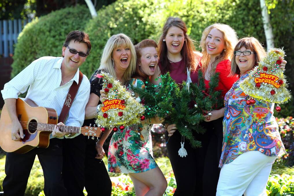 Paul Gibbs, Sharyn Bilston, Kristin Walsh, Courtney Newnham, Stephanie Flack, and Lizzie Pogson rehearse for the Albury Carols by Candlelight event, which will be held in QEII Square on Wednesday. Picture: MATTHEW SMITHWICK