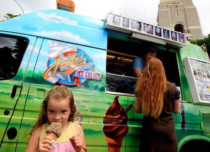 Isabel Tapia, 4, gives her business to one of Joe Girgenti's ice-cream trucks.