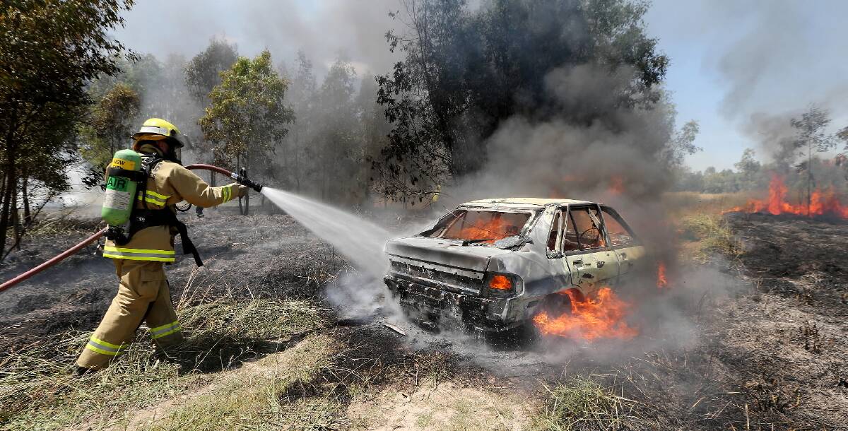 Oscar Ransden’s stolen car burns at Mungabareena Reserve. Picture: JOHN RUSSELL