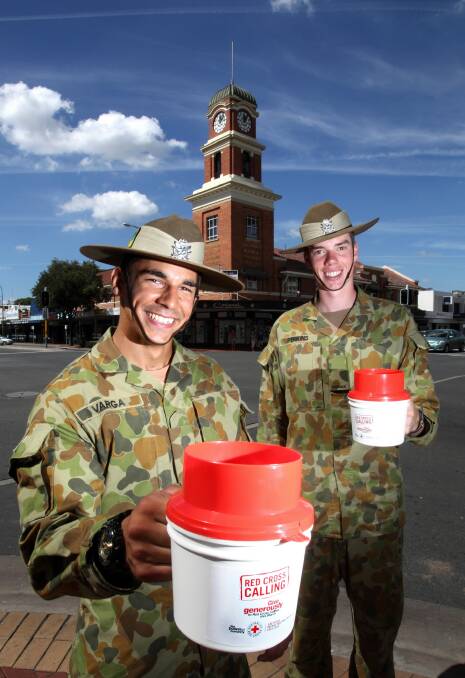 Troopers Szabi Varga and Alistair Perkins collect money for Red Cross Calling in central Albury yesterday. Picture: KYLIE ESLER