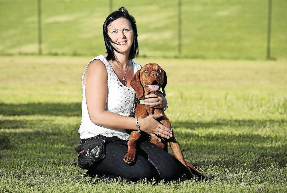 Albury Kennel Club vice-president Ilse Roos and her dog Rolly at the off-leash park next to Bunton Park in North Albury. INSET: Jake Yong’s dog Yuki meets Rolly. Pictures: BEN EYLES