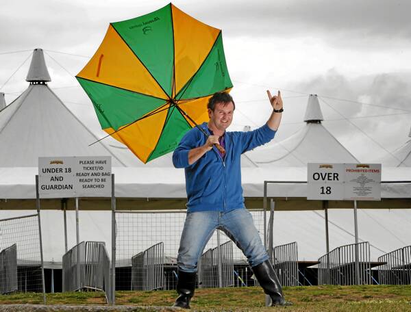 Powderfinger fan Tim Wilson, of Wodonga, has all weather bases covered for the concert at the Albury Sportsground tonight. Picture: KYLIE GOLDSMITH