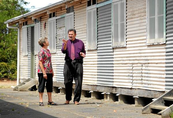Sophie Arendt and Rick Grubissa reminisce outside what’s left of the Benalla Migrant Centre. Picture: MATTHEW SMITHWICK