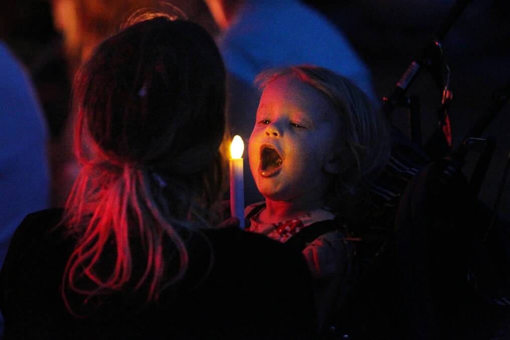 Enjoying Wodonga’s Carols by Candlelight last night were Sarah Hoving and her daughter Daphne, 2, of Albury.