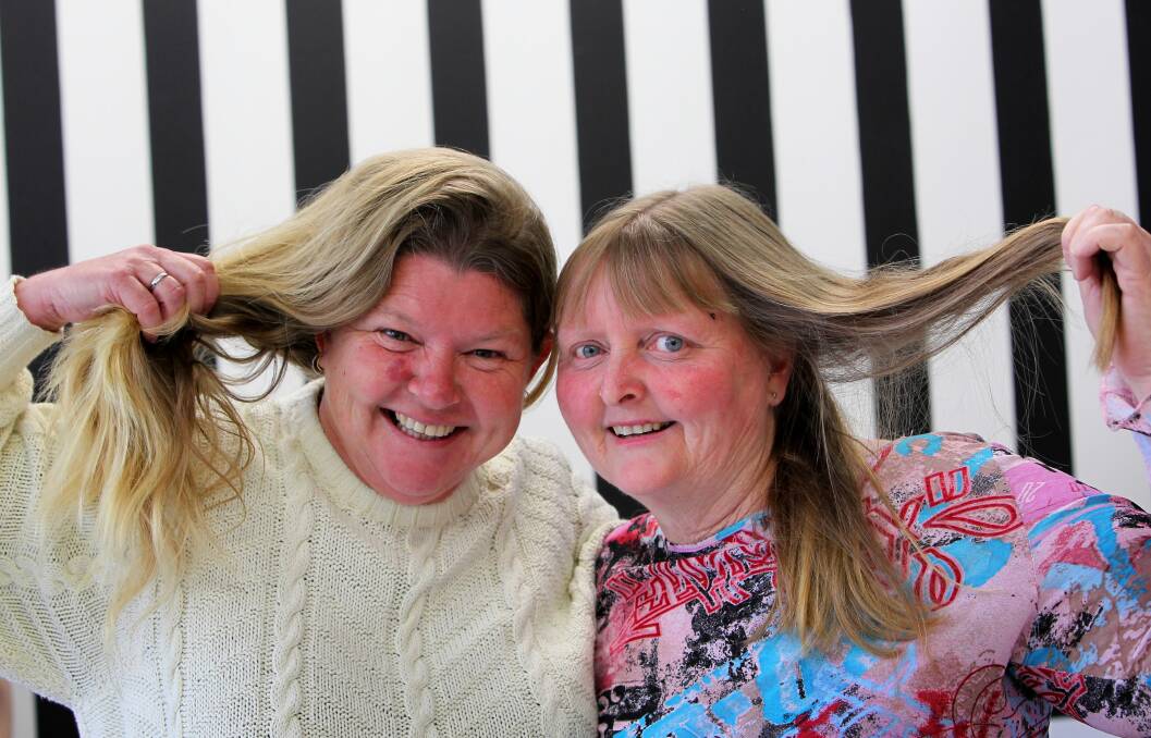 Lorraine Costanzo had her hair cut by Jazz Hair Studio owner Belinda Bowers along with friend Tina Flint in order to donate it to be made into wigs for those with alopecia and cancer. Pictures: MATTHEW SMITHWICK