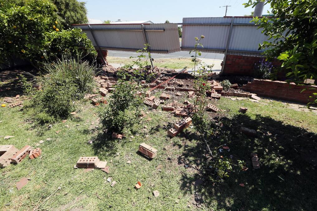 Bricks fly at Wodonga house as car rams fence