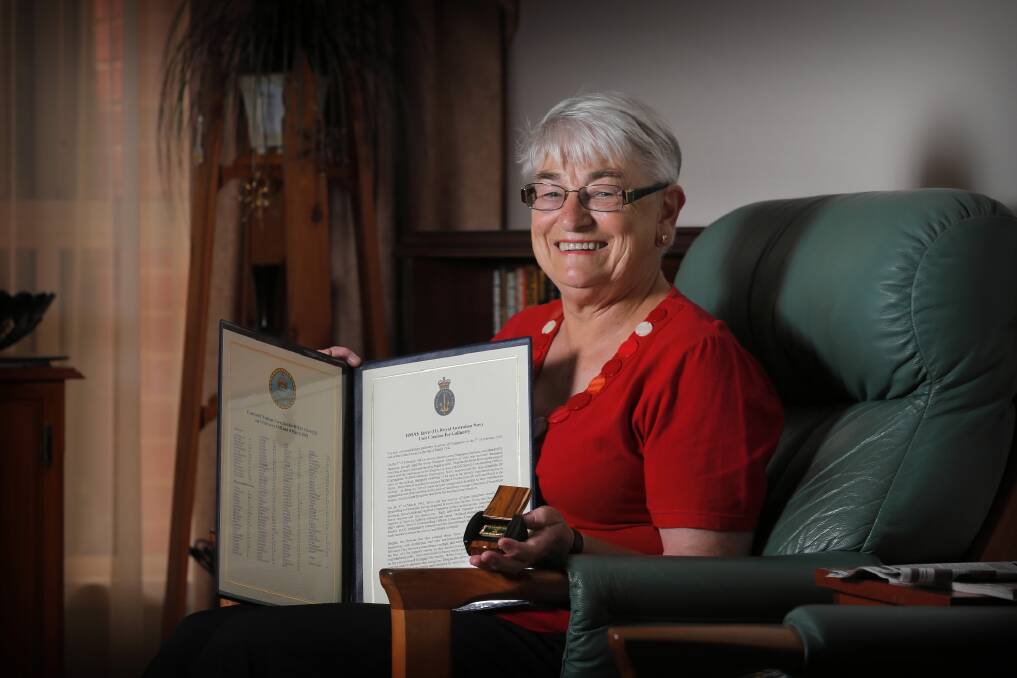 Pam Shirley at home in Wodonga with a copy of the citation and ribbon honouring the crew of the HMAS Yarra. Picture: TARA GOONAN