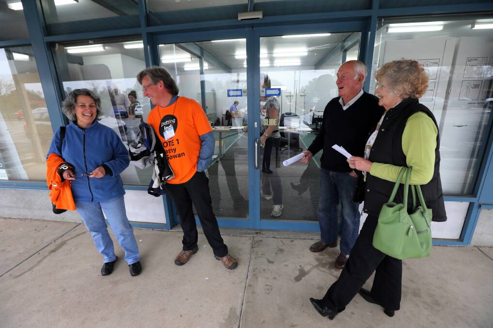 Scrutineers Anna Roberts and Mark Waters (Cathy McGowan) and Tom Maher and Jan McEwan (Sophie Mirabella) have faced a gruelling task at the Wangaratta electoral office. Picture: PETER MERKESTEYN