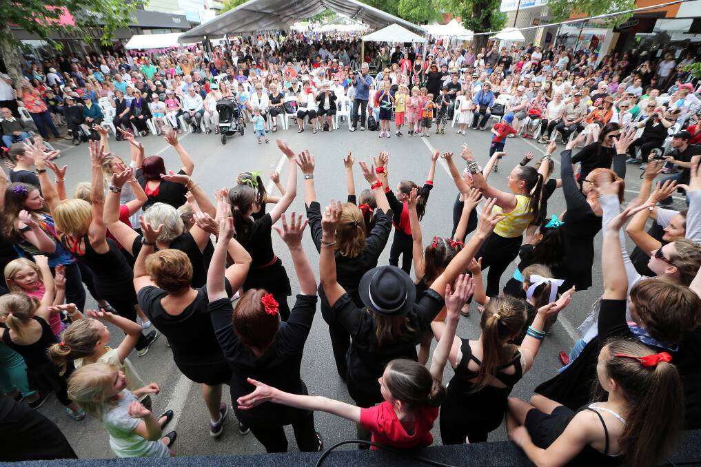 The Jazz Attack flash mob surprises the audience at the Reid Street stage on Saturday.