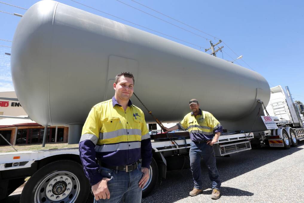 DTD production manager Cameron Hawke and leading hand John Miller view the liquid ammonia vessel. Picture: PETER MERKESTEYN