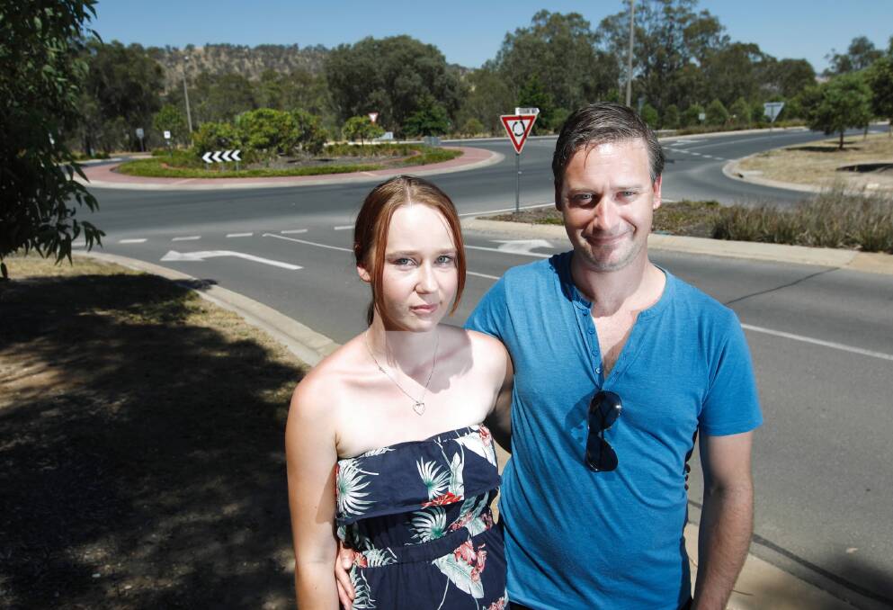 Sheridan Waite and Jeremy Simon say it is only a matter of time before there is a serious crash at the Anzac Parade roundabout unless the speed limit of 80km/h is lowered. A fire truck rolled there on Friday. Pictures: BEN EYLES, JOHN RUSSELL