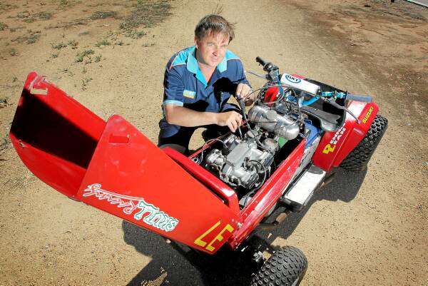 Competitor John Lean makes some last adjustments to his mower Wild Turkey. Picture: TARA GOONAN