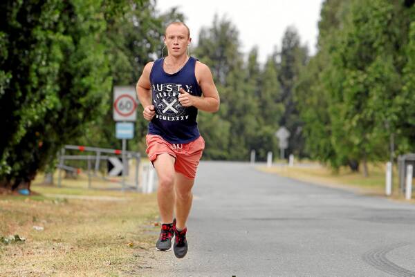 Caleb Love runs on Mungabareena Road in the days following a fatal car accident on the road. Pictures: MATTHEW SMITHWICK