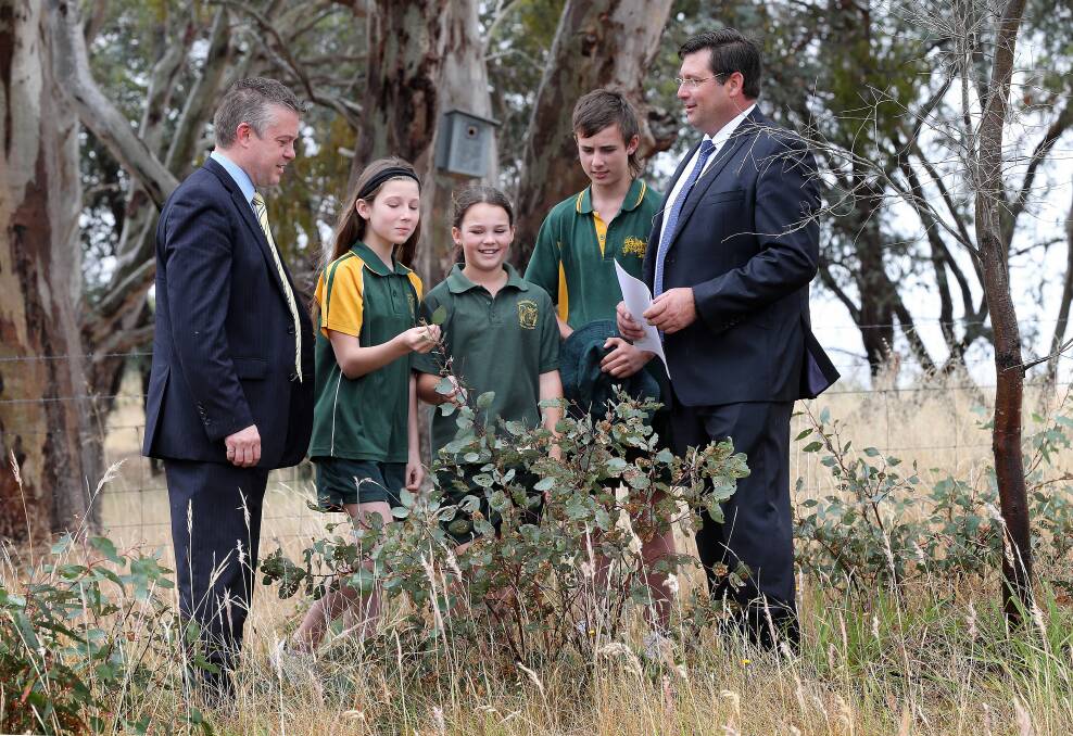 Environment Minister Ryan Smith, with Baranduda Primary School students Sophie Cooper, 11, Lara Reid, 11, and Sam Howard, 12 and Member for Benambra Bill Tilley after environmental funding was announced yesterday at Baranduda. Picture: John Russell