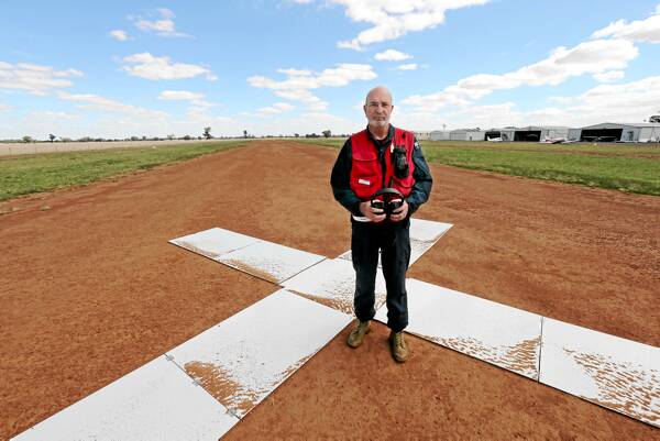 Peter McLean inspects the second airstrip that needs to be sealed at Yarrawonga airport. Picture: PETER MERKESTYN