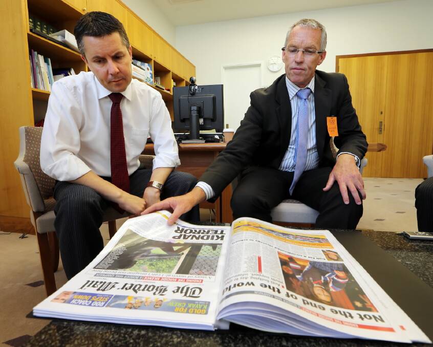 Mark Butler reads through the Border’s submission for an Albury-Wodonga headspace centre with former Albury mayor, Stuart Baker, in November last year.