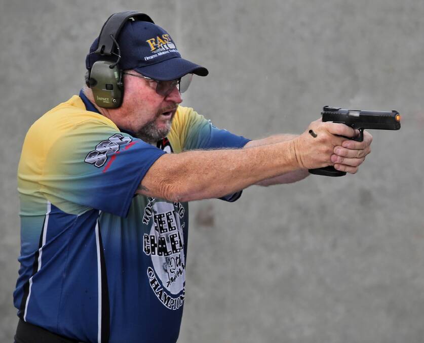 Sydney shooter Craig Ginger keeps his eyes on the targets as he warms up for this weekend’s event. Picture: BEN EYLES