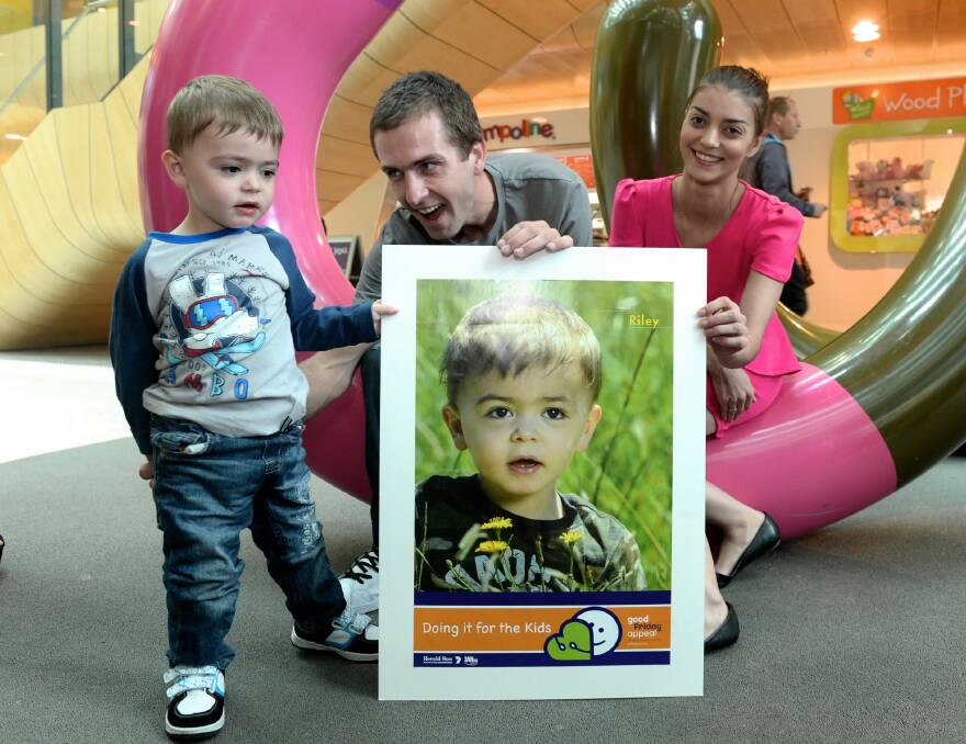 Riley Twomey, 2, and his parents David Twomey and Angelina Grasso are proud he has been chosen as the Royal Childrens Hospital Good Friday appeal poster child. Picture: THE AGE