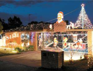 The Squires family in Kaitlers Rd, Lavington, added a candy cane and Christmas tree to their lighting display this year. Pictures: JOHN RUSSELL