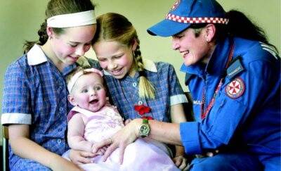 Laura, 12, Caitlin, 10, with baby Ella Bishop, 19 weeks, and Albury paramedic Fiona Dillon. Picture: KYLIE GOLDSMITH