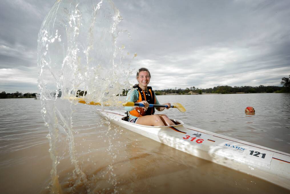 For Laura Collins, there is no better way to kick off the day than a sedate paddle at Gateway Lakes with her Victory Lutheran College classmates. Picture: TARA GOONAN