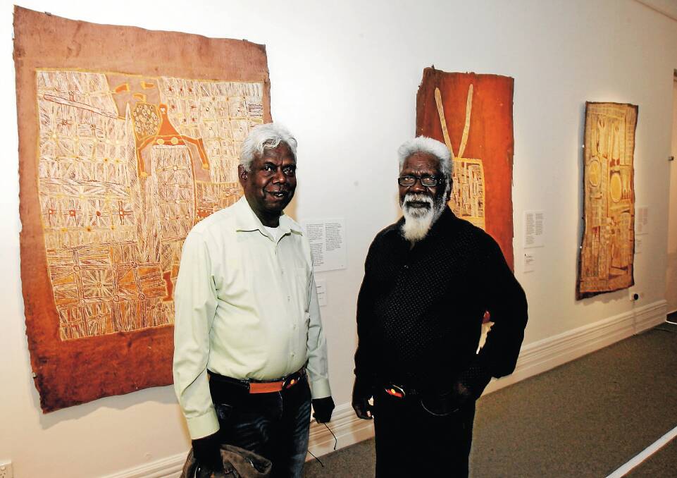Joe Neparranga Gumbula and George Milaypuma Gaykamangu admire the exhibition at the Albury Art Gallery. Picture: PETER MERKESTEYN