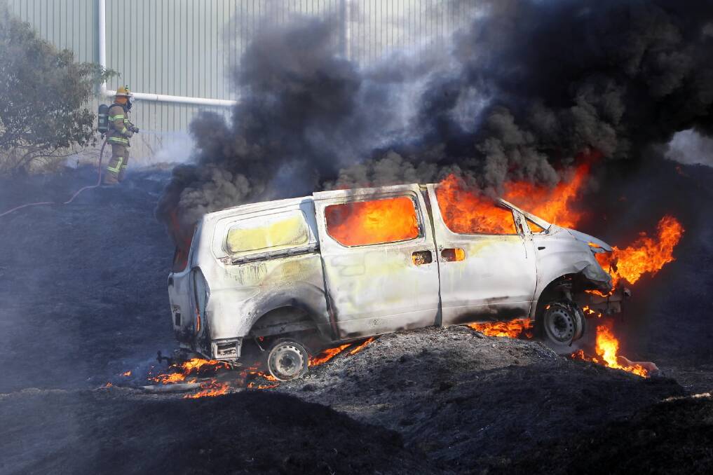 The van burns, with the intensity of the flames turning the black van white. Picture: JOHN RUSSELL
