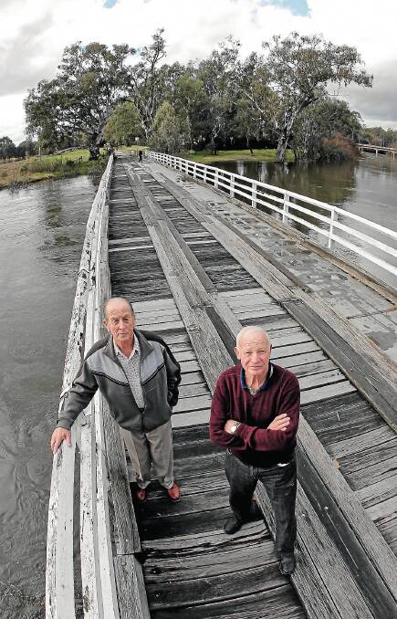 Jim Parker and Joe Reuss say the old Wodonga stock bridge over Wodonga Creek should be repaired, rather than replaced with a new one at another site. Picture: DAVID THORPE