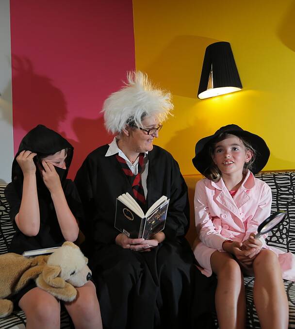 Lavington Public School student Kylan Duffy, 9, Lavington Library programs officer Narelle Drewe and Holy Spirit student Sage Cronin, 9, at the summer reading club launch yesterday. Picture: Tara Goonan