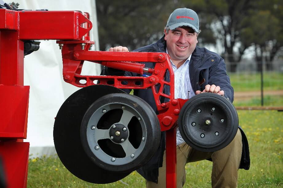 Michael McCormick, of McIntosh Distribution, with the Henty Machine of the Year, the Morris Industries RAZR Disc Drill. Picture: MATTHEW SMITHWICK